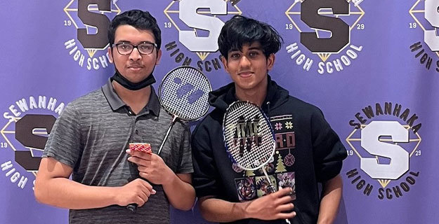 Two students holding badmitton rackets