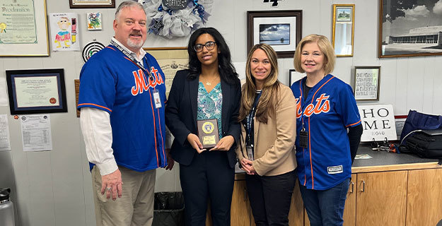 New Hyde Park Memorial High School student Victoria Horne With Staff Members