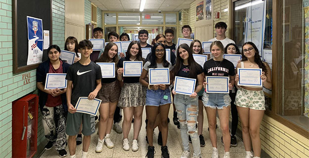 ​H. Frank Carey High School Students holding certificates