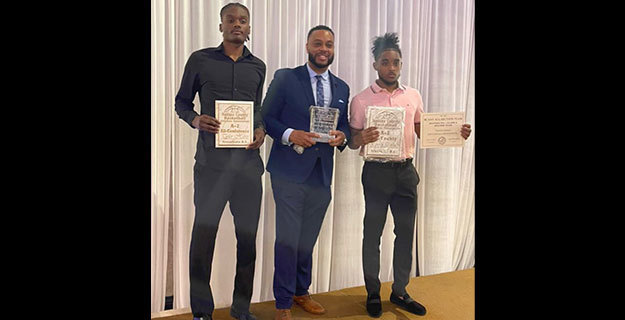 Sewanhaka student-athletes Holding Awards