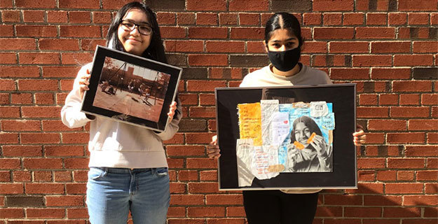 Nuella De Torrontegui and Gagandeep Kaur Holding Their Artwork