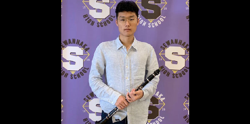 Tae Lee holding his Clarinet