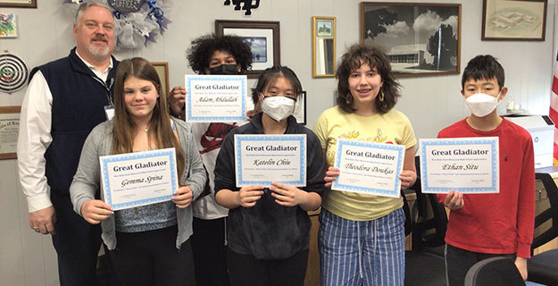 February Great Gladiators Standing With Certificates