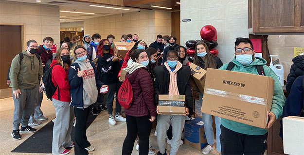Students With Boxes of Donated Goods