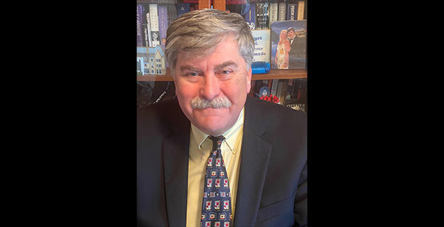 Dr. Dolan smiling at the camera