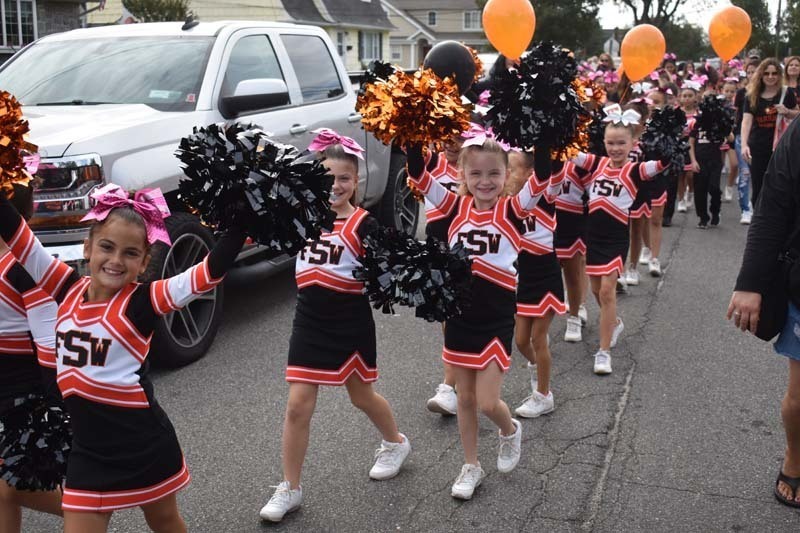 Young Cheerleaders March in Parade