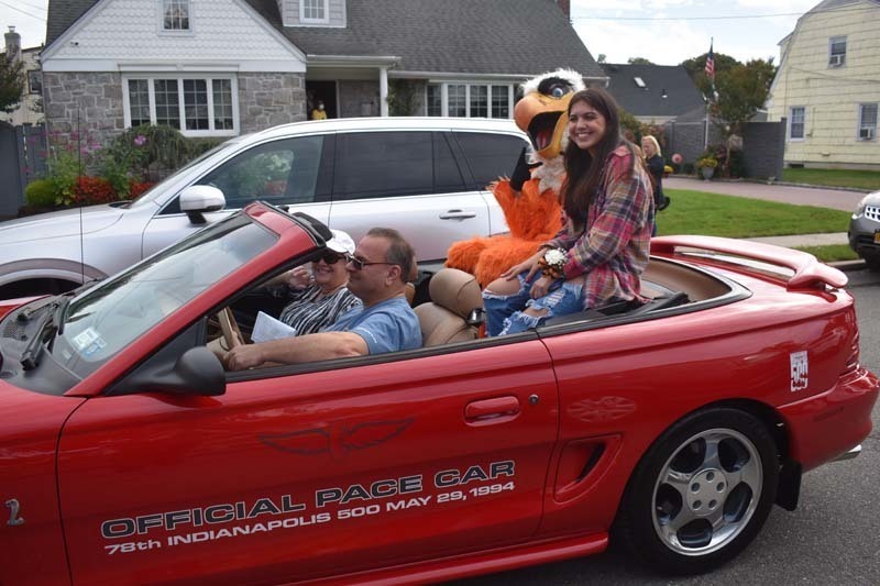 Student and Mascot in Car During Parade