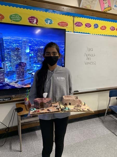 Student Holding Her Project