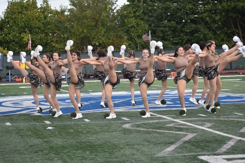 Kickline Team Performing During Homecoming Ceremonies