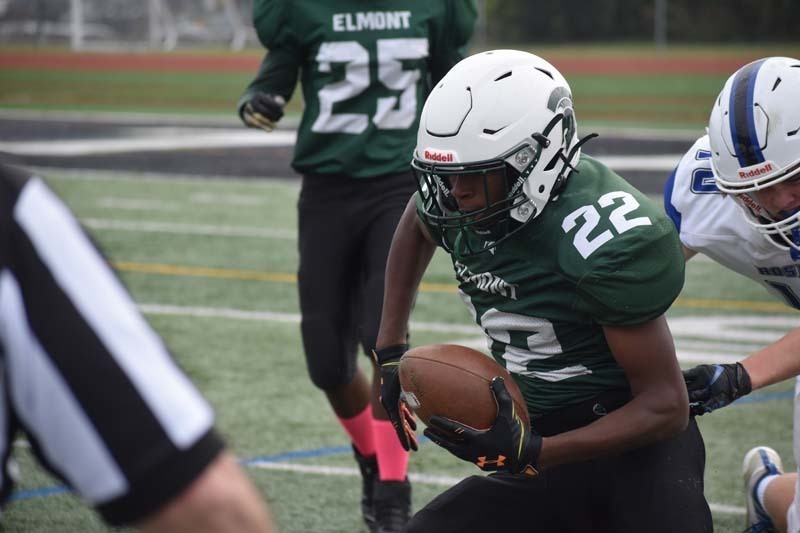 Elmont Memorial HS Football Players in Action