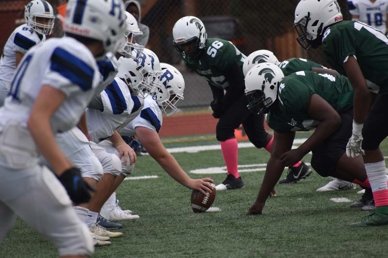 Elmont Memorial HS Football Players in Action