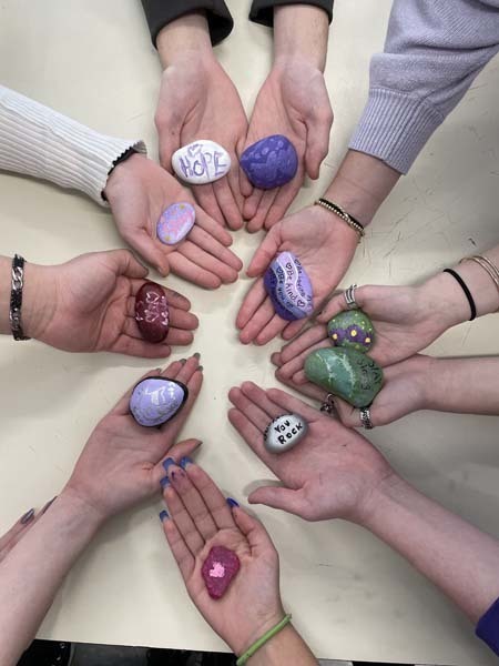 Students Holding Colorful Rocks for PS I Love You Day 2022