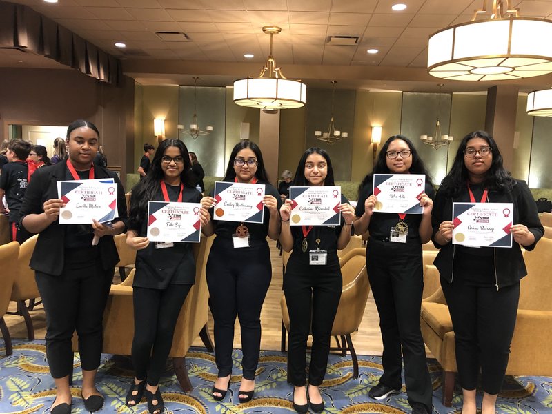 Sewanhaka High School students Ashna Balroop, Win Hla, Catherine Krisenlall, Lucila Mathieu, Emiley Muthusamy and Feba Saji Holding  Certificates