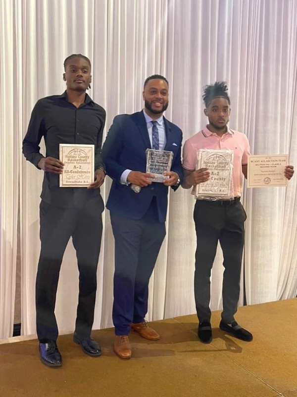 Sewanhaka student-athletes Holding Awards