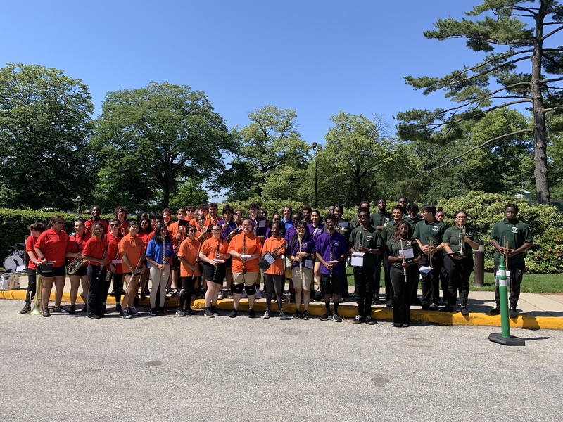  Band students and teachers from all five high schools Wearing Rainbow Shirts