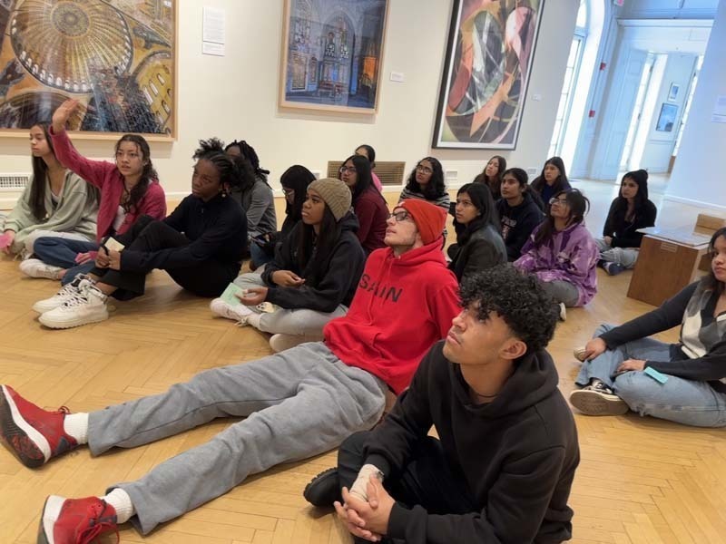 Students looking at artwork at  Nassau County Museum of Art