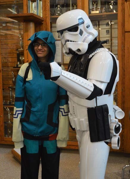 A dressed up student standing with a Storm Trooper
