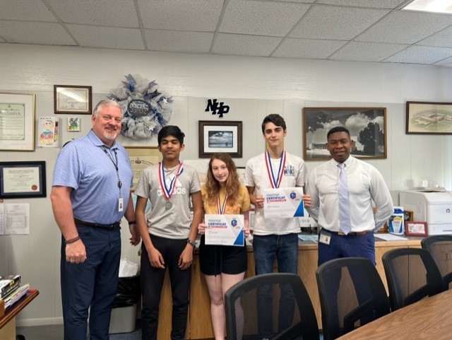 Anirudh Arvind, Lily LeSchack, and Jakob Hochheiser holding certificates